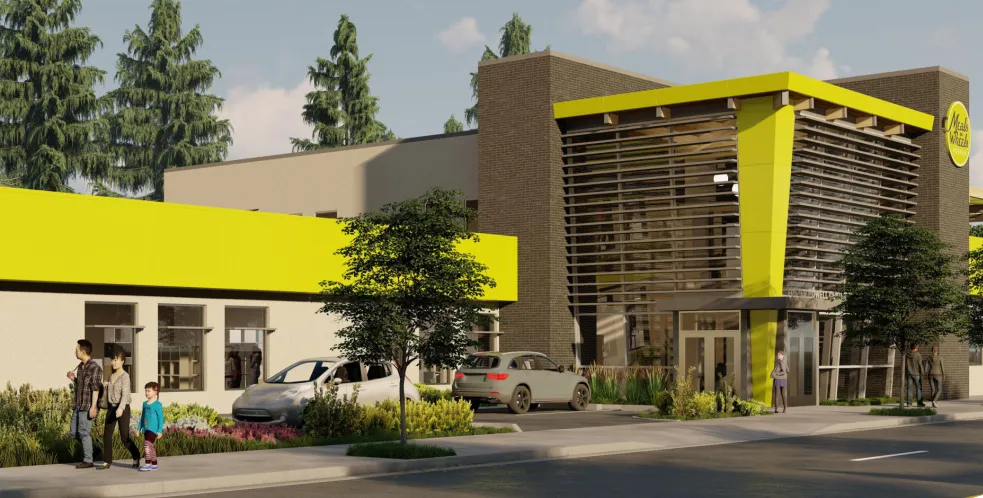 An exterior rendering of the future Meals on Wheels People Eastside Resource Center. A modern building exterior with a vibrant yellow and gray facade, large sign, and surrounding greenery. People walk along the sidewalk under a clear sky.